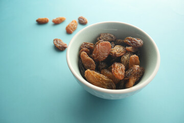  big size raisin on light green color bowl 