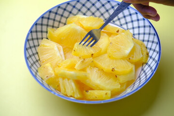 slice of pineapple in bowl on table 