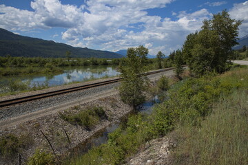 Fototapeta na wymiar Railway along Columbia River at Spillimacheen in British Columbia,Canada,North America 