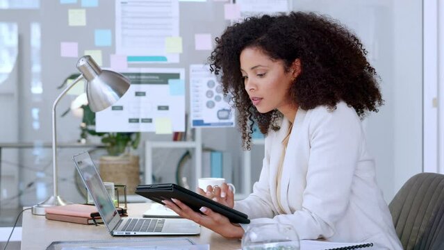 Business woman doing research on digital tablet and testing app software while communicating with developers. Data analyst typing on laptop and comparing information while analysing financial report