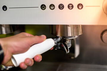 Hand squeezing to make coffee in automatic coffee maker