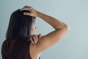 asian women sore shoulder, girl shoulder pain on white background
