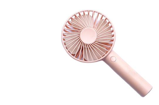 Mini electric pink fan with handle, isolated on white background. Concept : Portable electrical equipment that very useful when hot weather.                