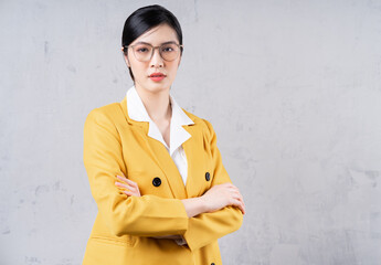 Portrait of young Asian businesswoman on background