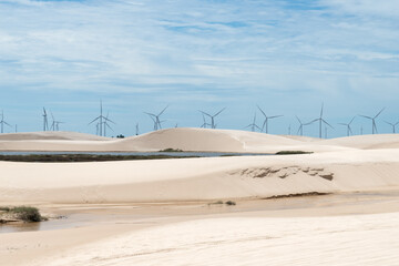 Windmills in LenÃ§Ã³is Maranhenses National Park in Brazil