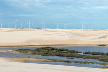 Windmills in LenÃ§Ã³is Maranhenses National Park in Brazil