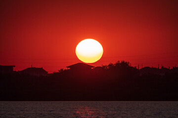 The sun goes down over a lake