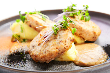 Fishcakes with garden cress closeup view