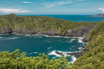 coastal landscape with reefs and vegetation on an island in Costa Rica