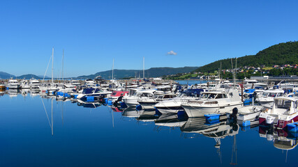 Fototapeta na wymiar Sykkylven, Norway - June 29, 2022: yachts in the marina