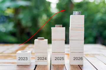 wooden block with up arrow, monetary growth, interest rate increase, inflation concept