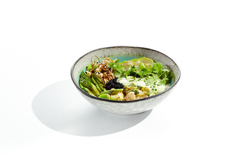 Vegan food - poke bowl with vegetables, edamame beans, soybean sprouts. Poke bowl with avocado and vegetables isolated on white background. Eat less meat. Plant - based eating.
