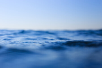 Naklejka na ściany i meble Sea surface close-up. Deep blue sea 