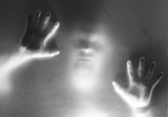 Shadowy figure, man behind glass - horror background