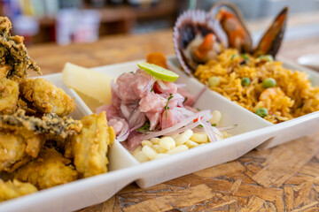 Peruvian food: Fish ceviche, rice with seafood and fish cracklings.