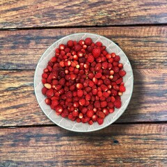 Fresh organic strawberries in bowl.
