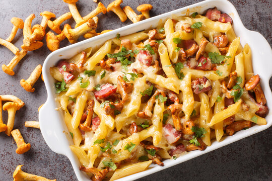 Homemade Casserole With Pasta, Mushrooms, Bacon And Cheese Served Hot From The Oven On The Table. Horizontal Top View From Above