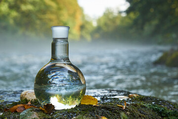 Flask with clear river water.