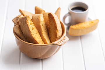 Sweet anicini cookies. Italian biscotti with anise flavor in bowl on white table.