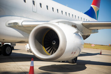Commercial jet aircraft parked in the parking area of the Kruguer National Park airport, it is a plane very used by tourists and vacationers.