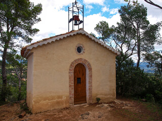 Village of Sillans-la-Cascade in Green Provence. The chapel Saint-Laurent on a hill above the...