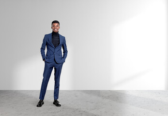 African American businessman wearing formal suit standing near w