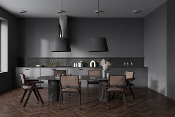 Grey kitchen interior with eating table and seats on wooden floor