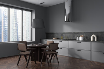 Grey kitchen interior with eating table and kitchenware, panoramic window