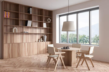 Meeting room interior with chairs and shelf with decoration, panoramic window