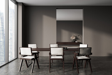 Front view on dark dining room interior with dining table