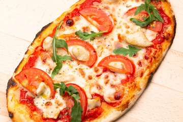 Delicious pizza served on wooden plate. Concept for advertising flyer and poster for restaurants or pizzerias, template with delicious taste of pepperoni.