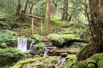 Old torii in the mountains and waterfalls