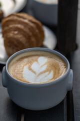 snack or breakfast croissant coffee with milk toast avocado and egg