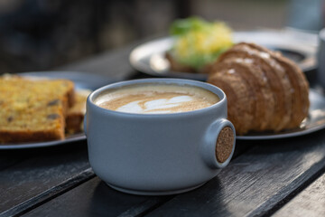 snack or breakfast croissant coffee with milk toast avocado and egg