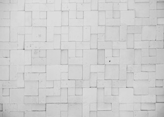 colorless geometric abstract  background of surface of textured decorative concrete brick wall