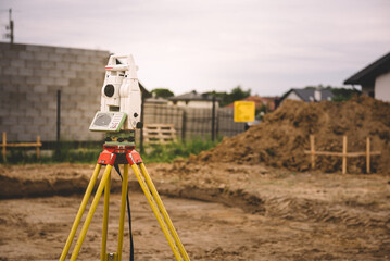 Surveyor equipment - GPS system or theodolite total positioning system outdoors at house...