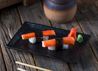 KANI authentic nigiri served in a dish isolated on wooden background side view of authentic nigiri