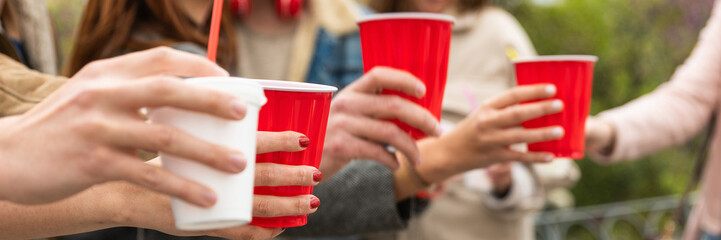 Happy diverse young people having fun delivery drink - Happy friends drinking and toasting from...