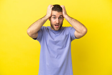 Fototapeta na wymiar Handsome blonde man over isolated yellow background doing nervous gesture