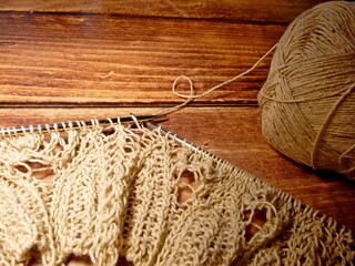 Openwork tablecloth in the process of knitting