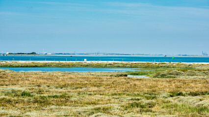 View across the swale estuary towards the Isle of Sheppey and the KingsFerry bridge in Kent, England