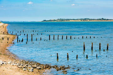 Obraz na płótnie Canvas View across the Swale Estuary to the Isle of Sheppey from Seasalter in Kent, England