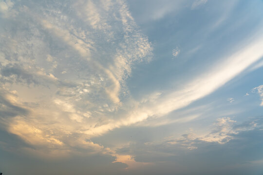 Beautiful clouds on blue sky and orange sunset