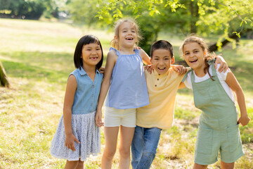 Group of asian and caucasian kids having fun in the park