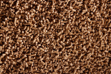 Pile of brown fuel pellets as abstract background