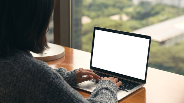 women using laptop showing white screen on desk