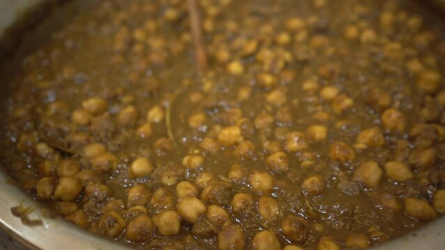 Close up shot of CHICKPEAS MASALA - Chole masala curry ,traditional Indian cuisine.