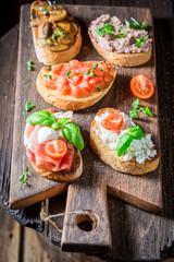 Hot and tasty mix of bruschetta with fresh ingredients.