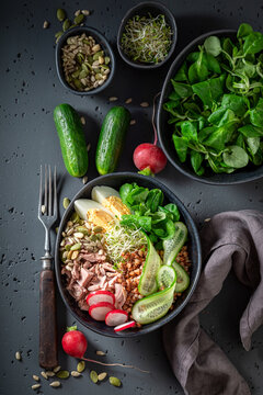 Diet Nicoise salad with cucumber, tuna and eggs.