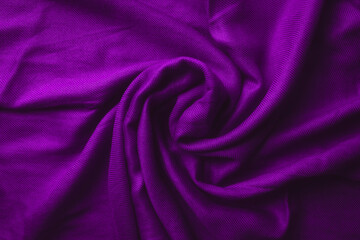 Fototapeta na wymiar Fabric texture background of purple color (Very Peri). Close up of clothes as wallpaper.